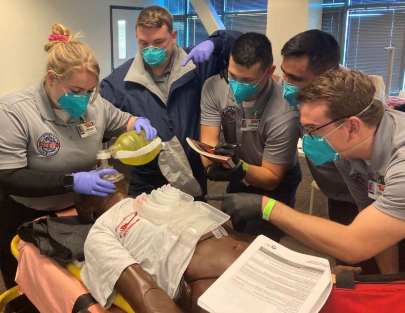 Paramedic Students Performing Advanced CPR