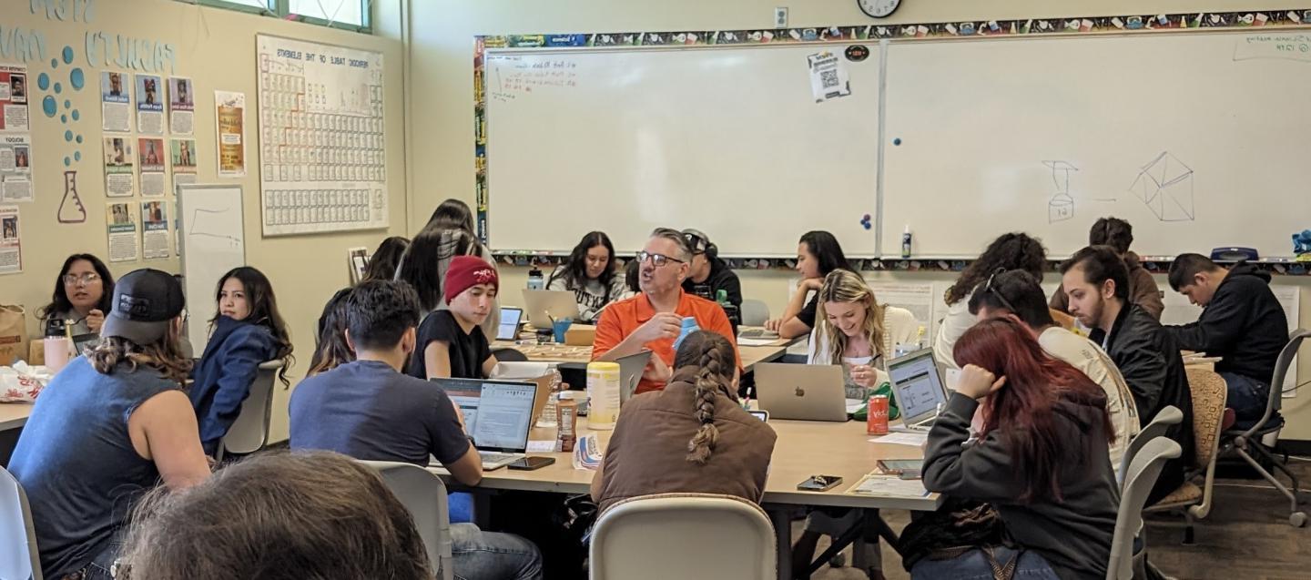 Students sitting at tables studying